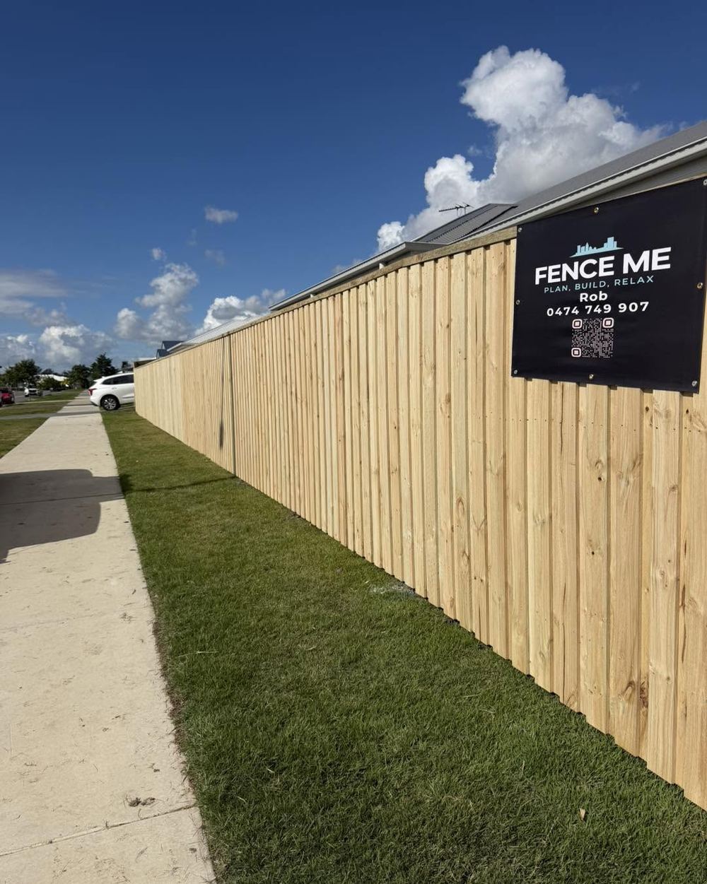 New treated timber paling fence with Fence Me sign